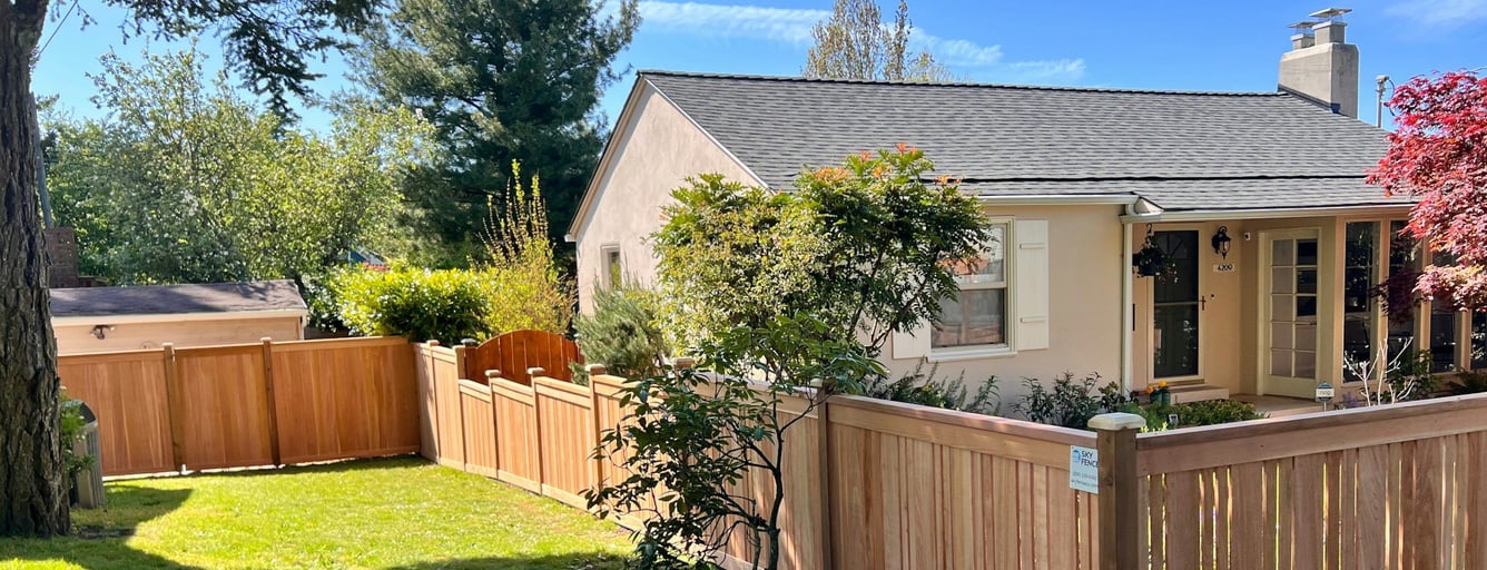 Single-story home with a newly stained cedar fence