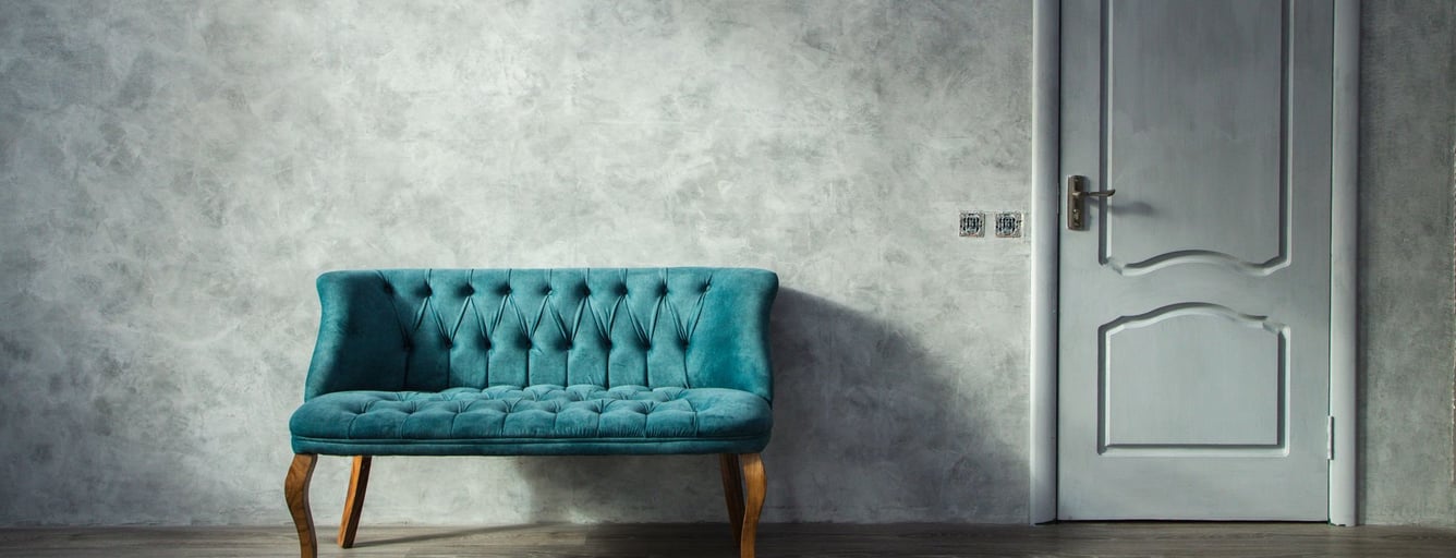 Living room wall with a soft gray Venetian plaster finish