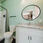 Apt 201 bathroom with walk-in shower and vanity