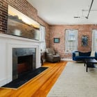 Apt 201 decorative fireplace with brick surround
