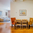 Apartment 303 dining area with in-unit stacked washer and dryer