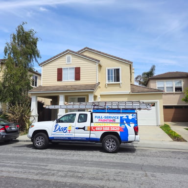 Diaz Professional Painting truck outside a client's home