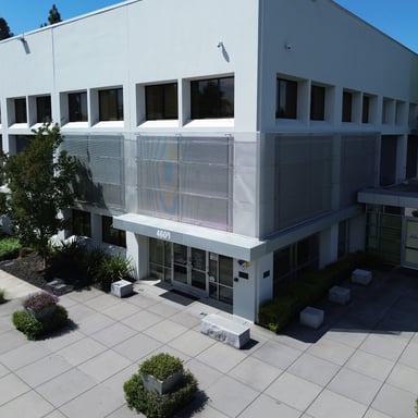 Aerial view of a freshly painted white office building