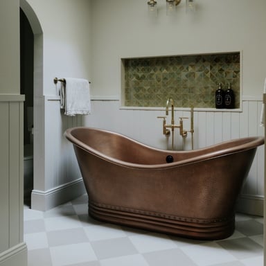 Bathroom with sage green walls and copper soaking tub