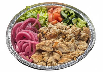 A bowl of grilled chicken over salad with pickled onions and cucumbers