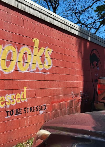The side wall painted with Brooks and Too Blessed To Be Stressed in yellow