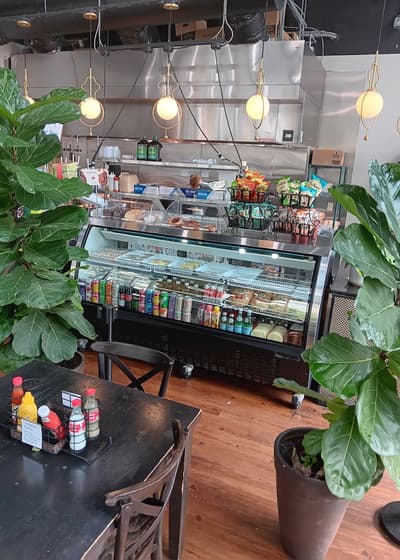 The deli case and drinks cooler by the counter
