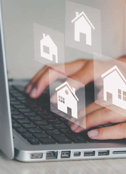 Real estate listings on a laptop