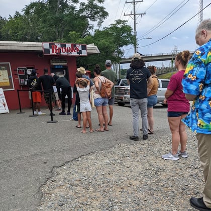 A long lunch line outside the stand