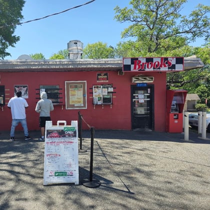 Customers lined up at the walk-up windows of the red stand