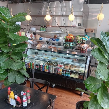 The deli case and drinks cooler by the counter
