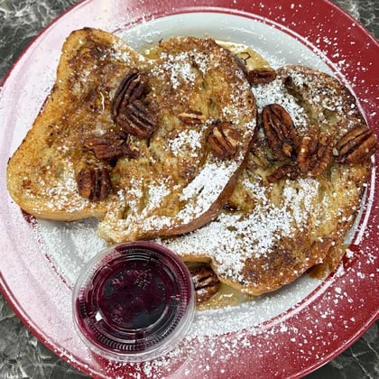 French toast with pecans and powdered sugar