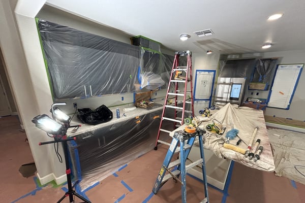 Kitchen masked and draped by the Diaz crew before painting