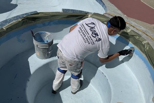 Diaz painter coating a swimming pool