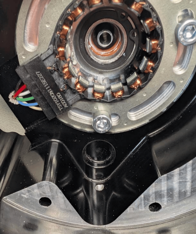 Close-up of a motor stator with copper windings inside the motor housing