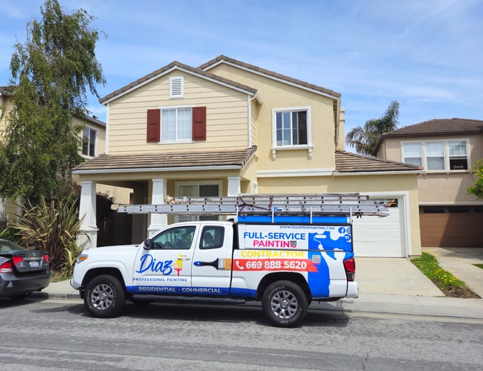 Diaz Professional Painting truck parked outside a client's home