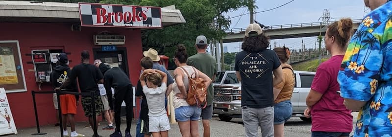 A long lunch line outside the stand