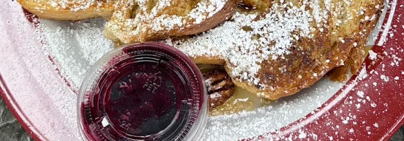 French toast with pecans and powdered sugar