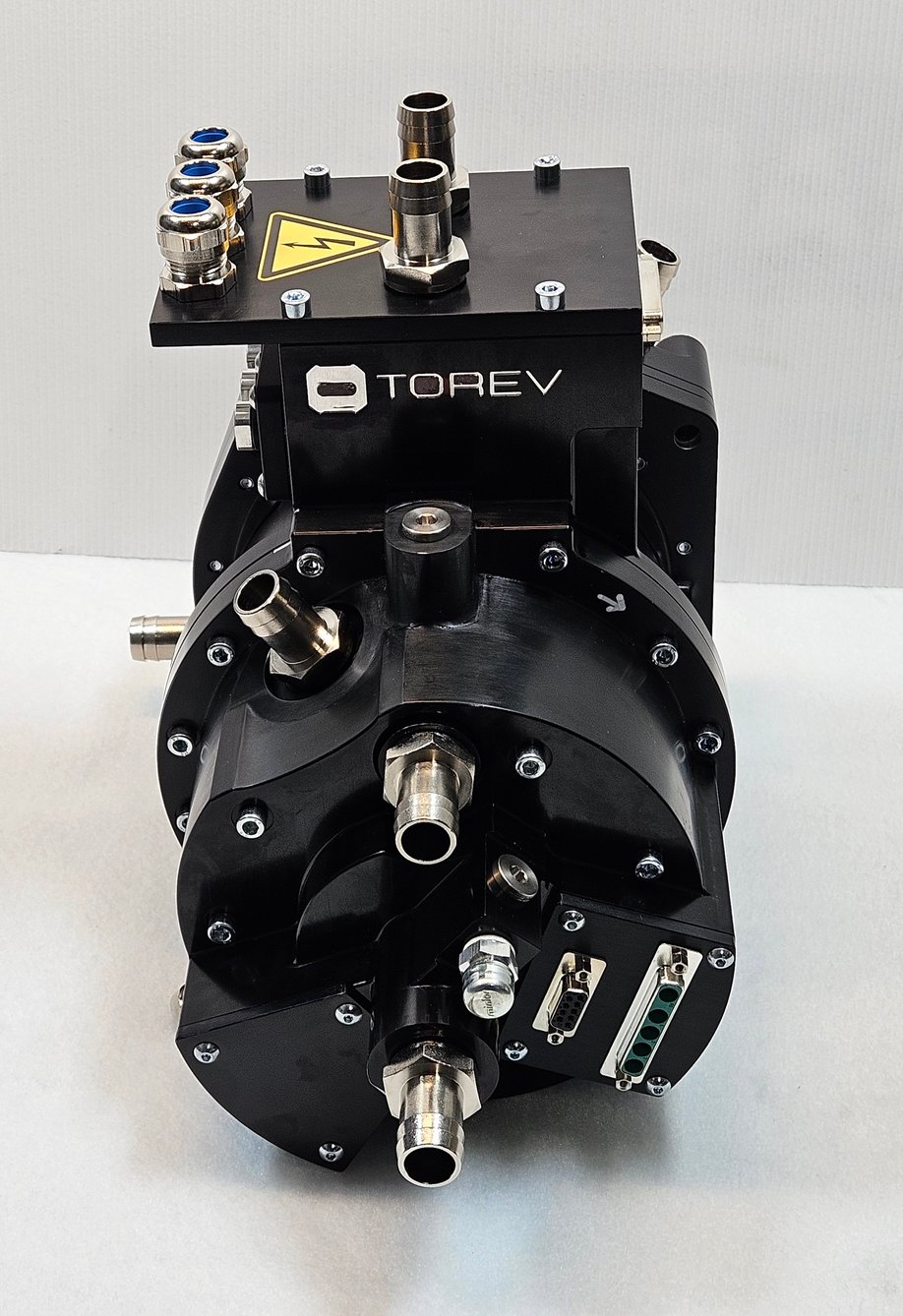 Torev axial flux electric motor prototype with oil cooling fittings and high-voltage connector box